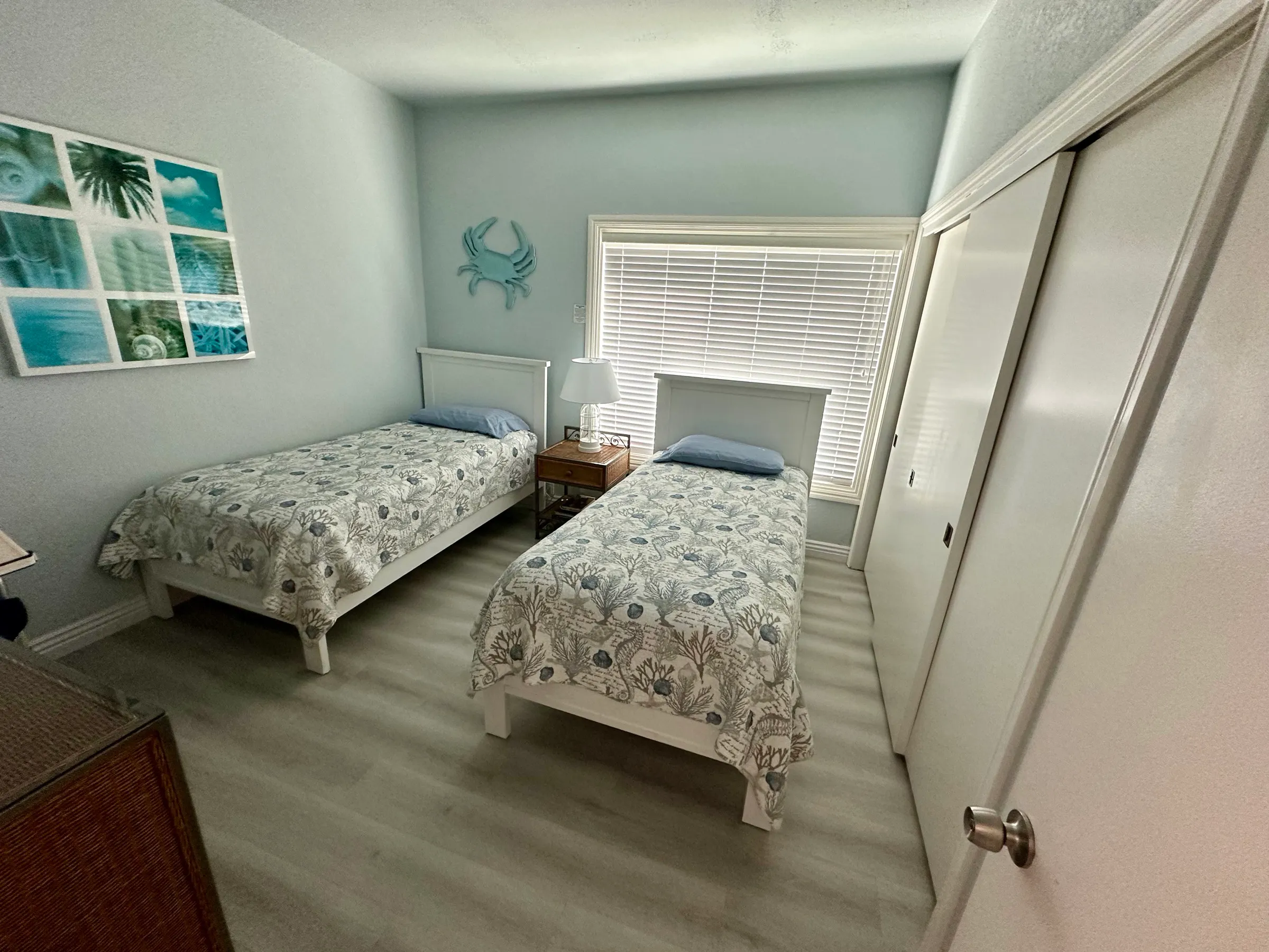 Bedroom one from the doorway, with its long closet on the right