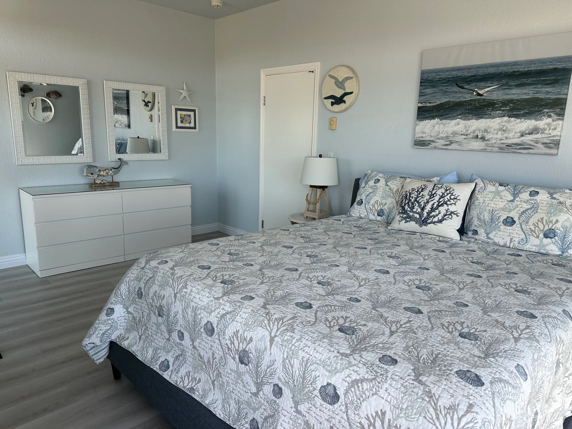The master bedroom's California king bed and dresser
