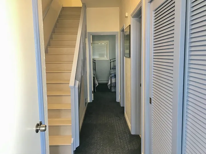 The hallway and the stairs between the two levels