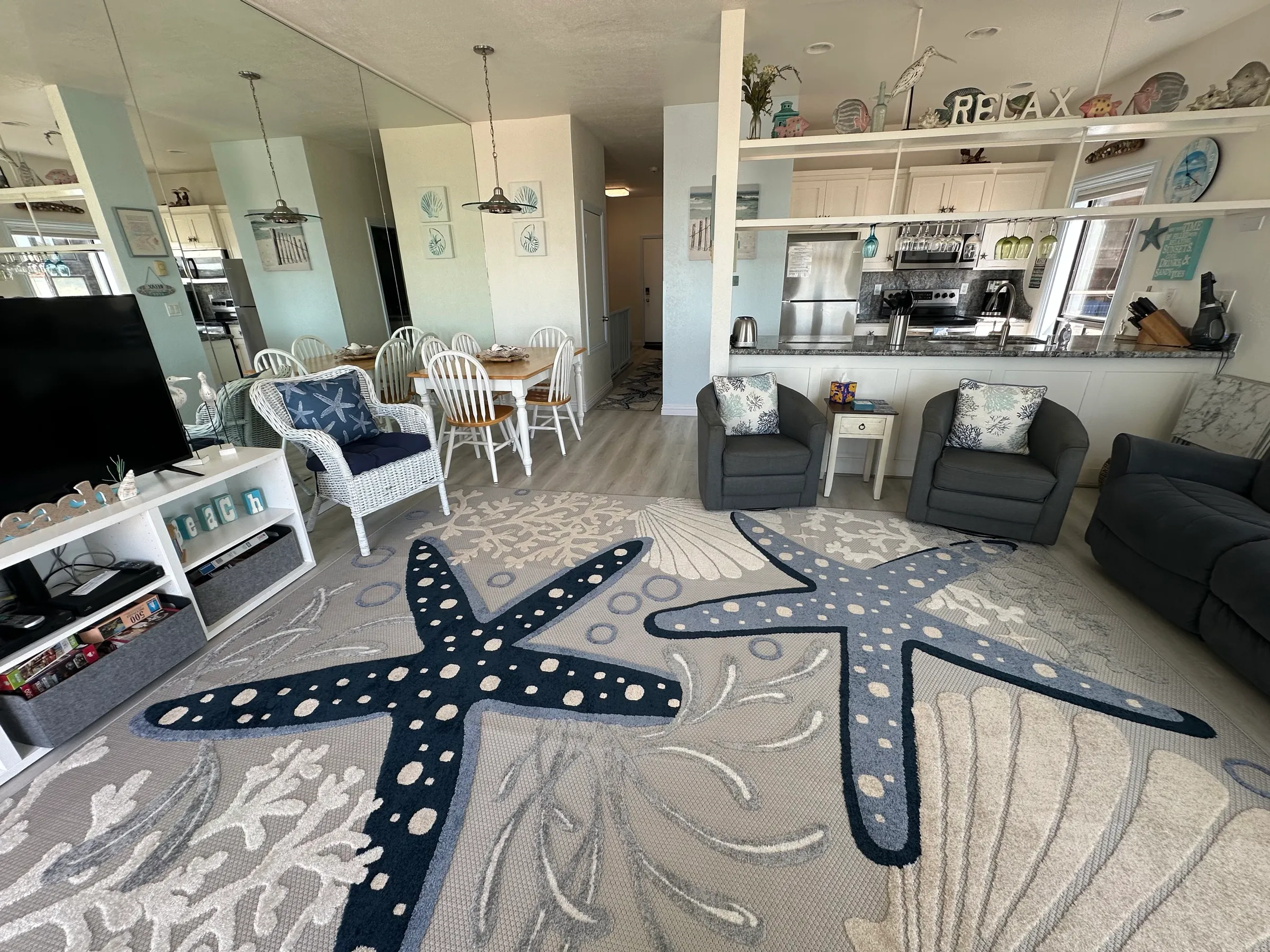 The living room, looking toward the dining table and the kitchen