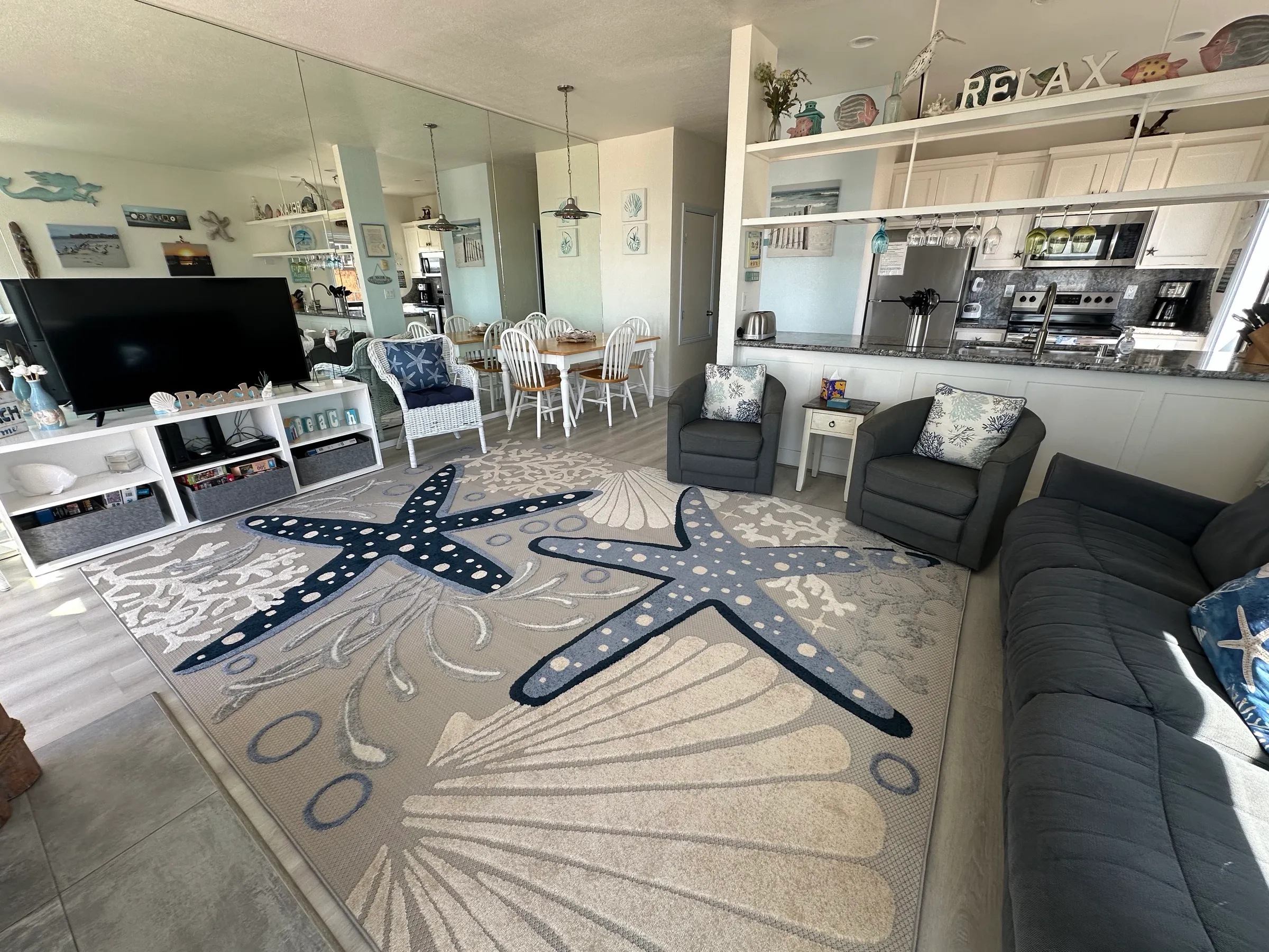 The open living room, dining area and kitchen